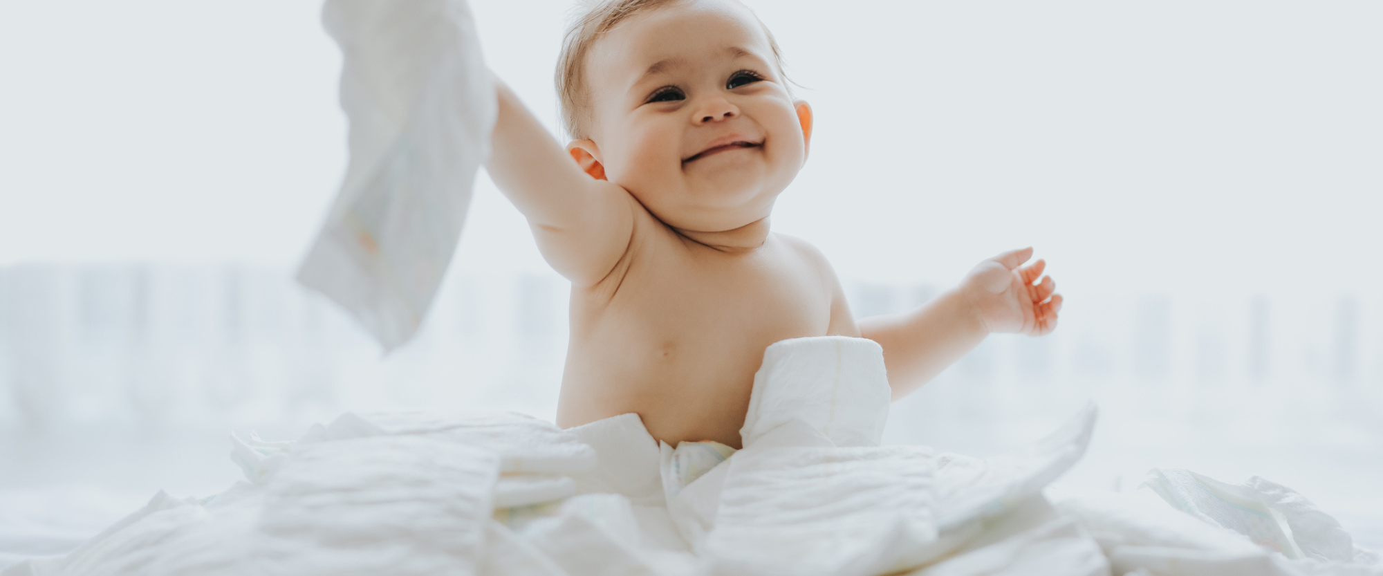 baby is playing on diapers