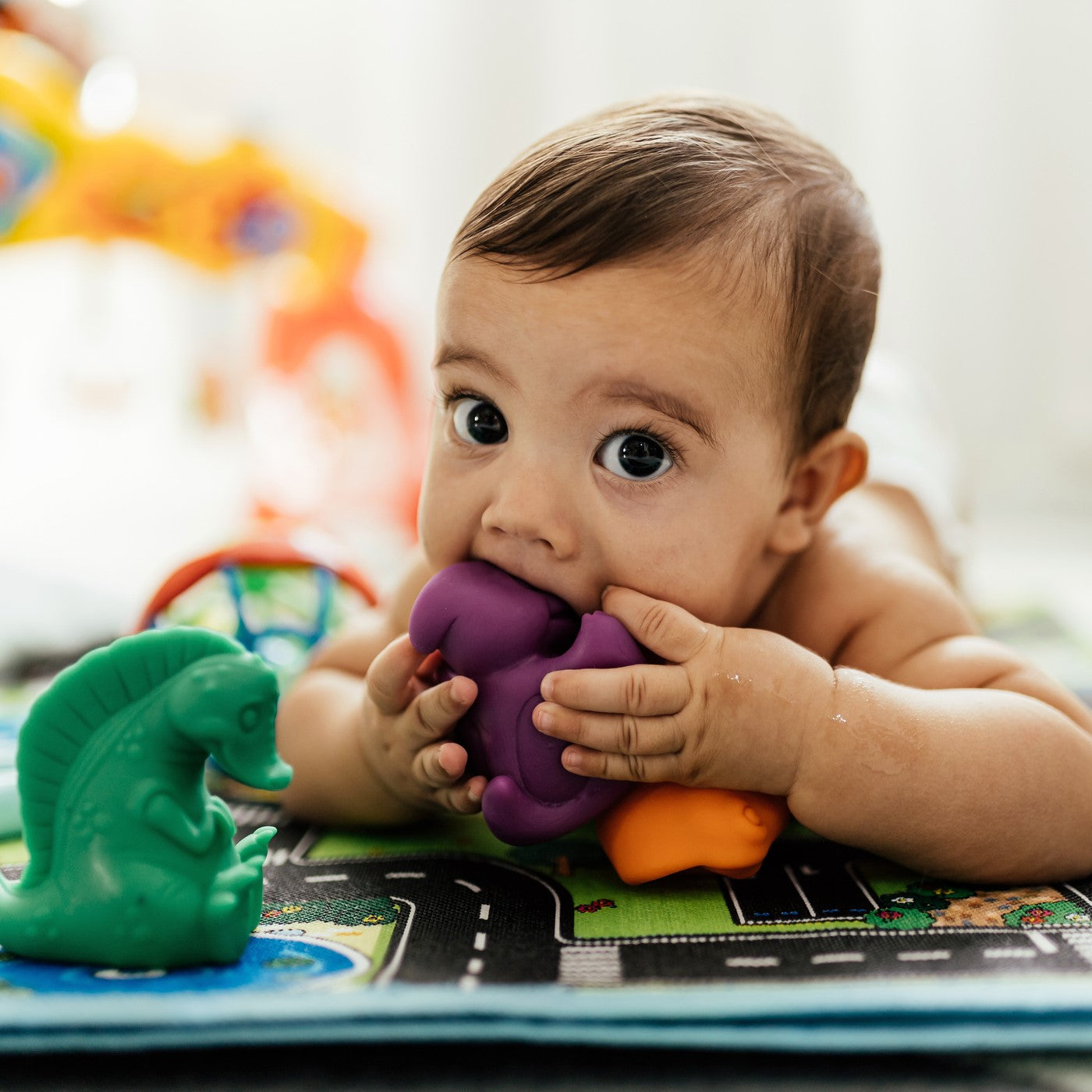 baby playing with toys on the floor