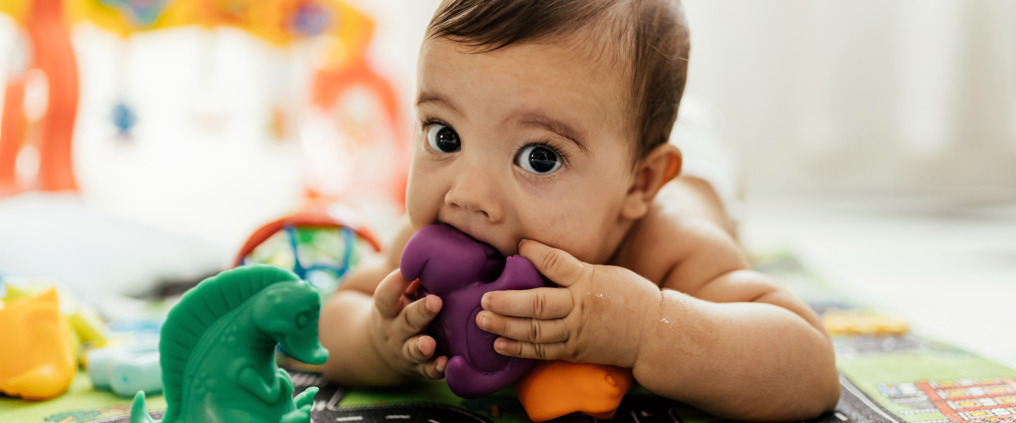 baby playing with toys on the floor