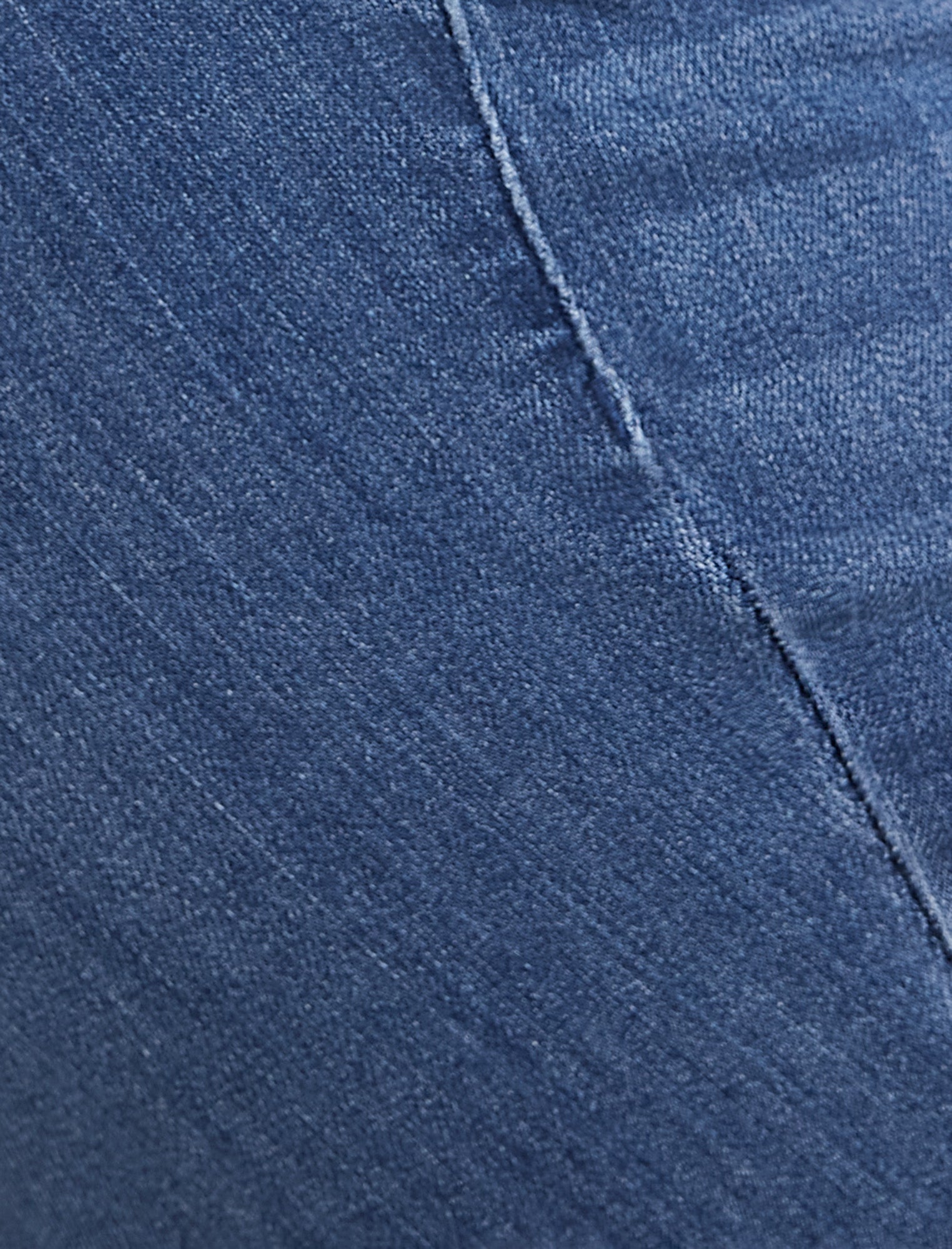 Closeup of blue maternity jeans