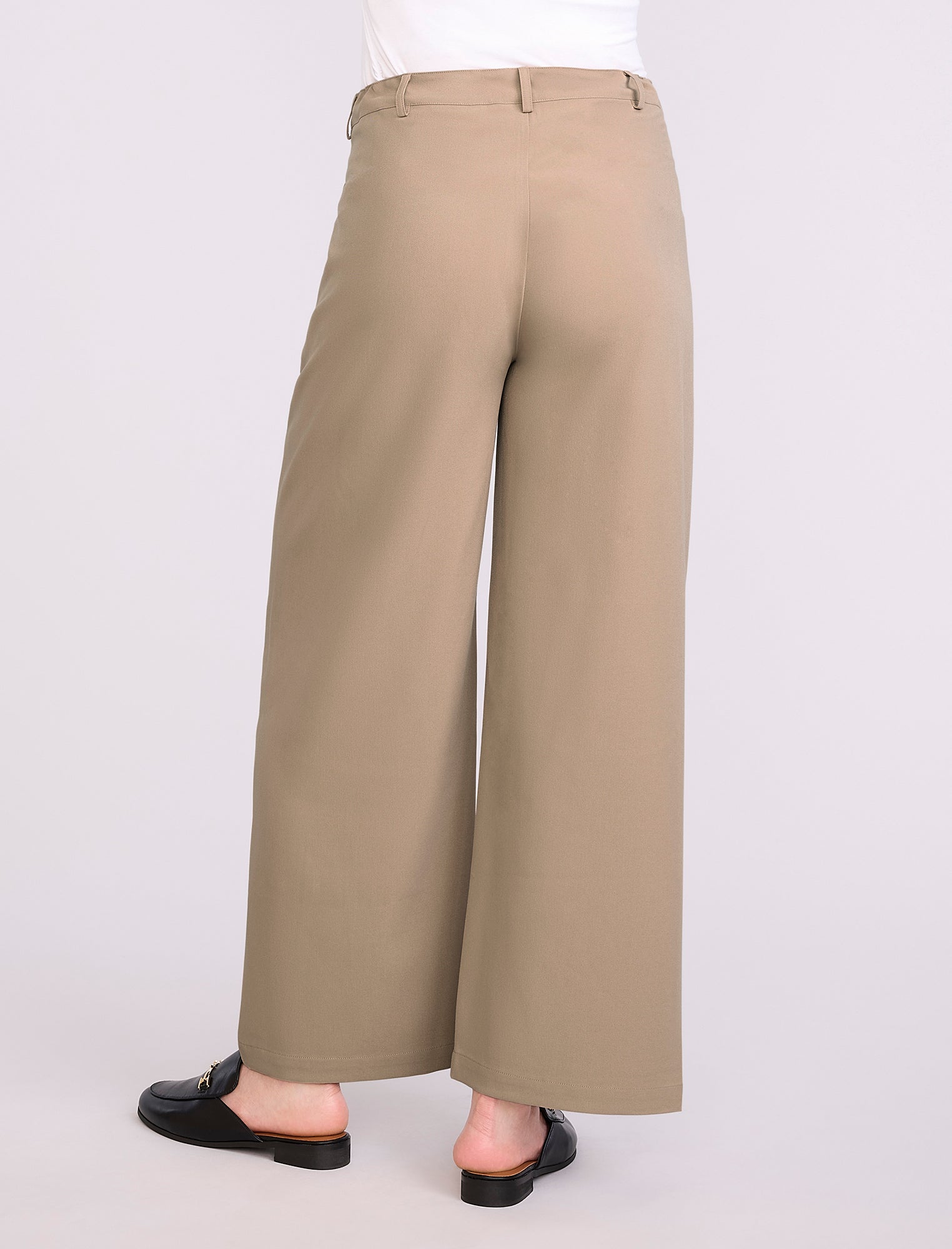 Beige wide-leg maternity pants worn by a person on a white background