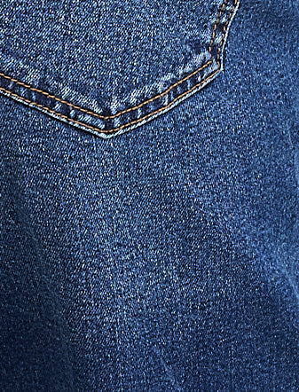 Close-up of a blue denim pocket with stitching detail