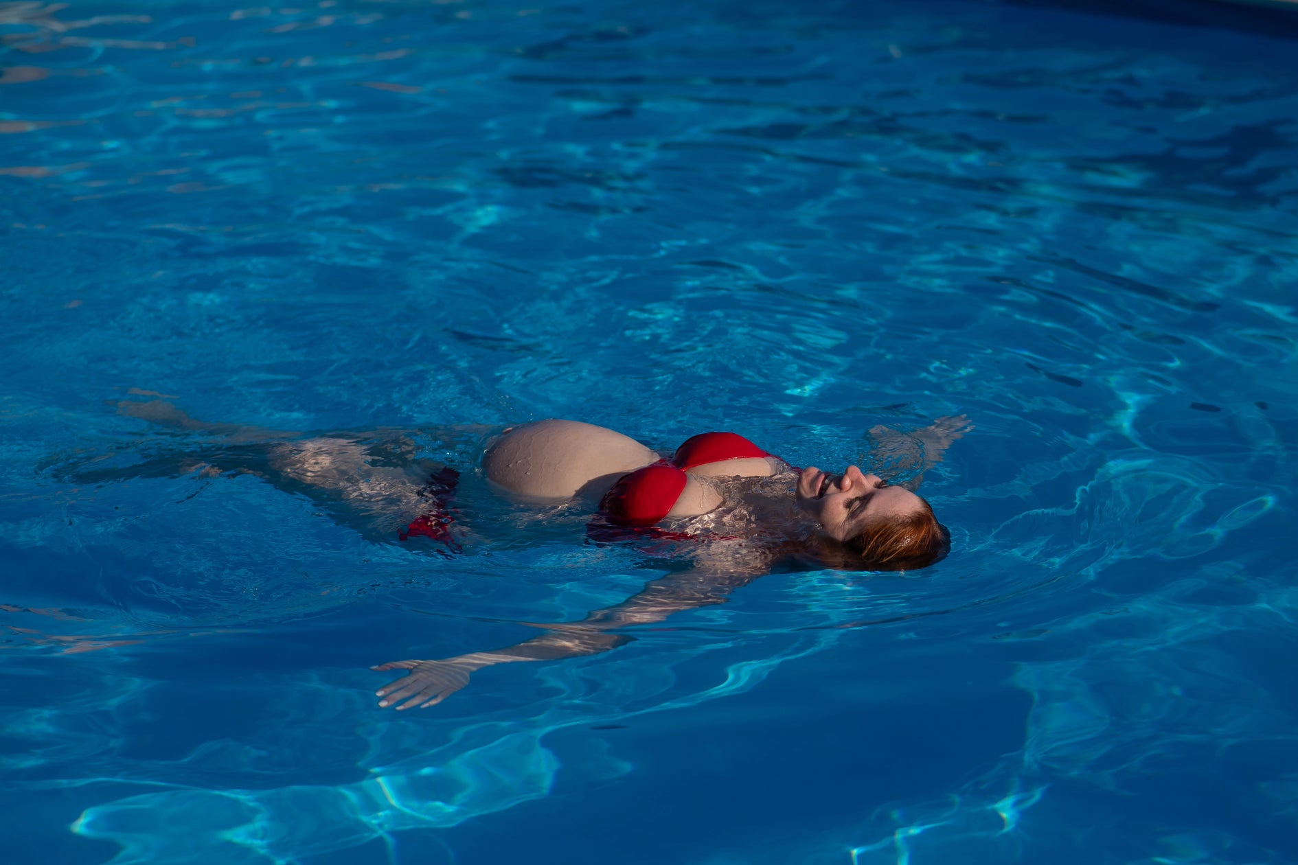 pregnant woman floating in water