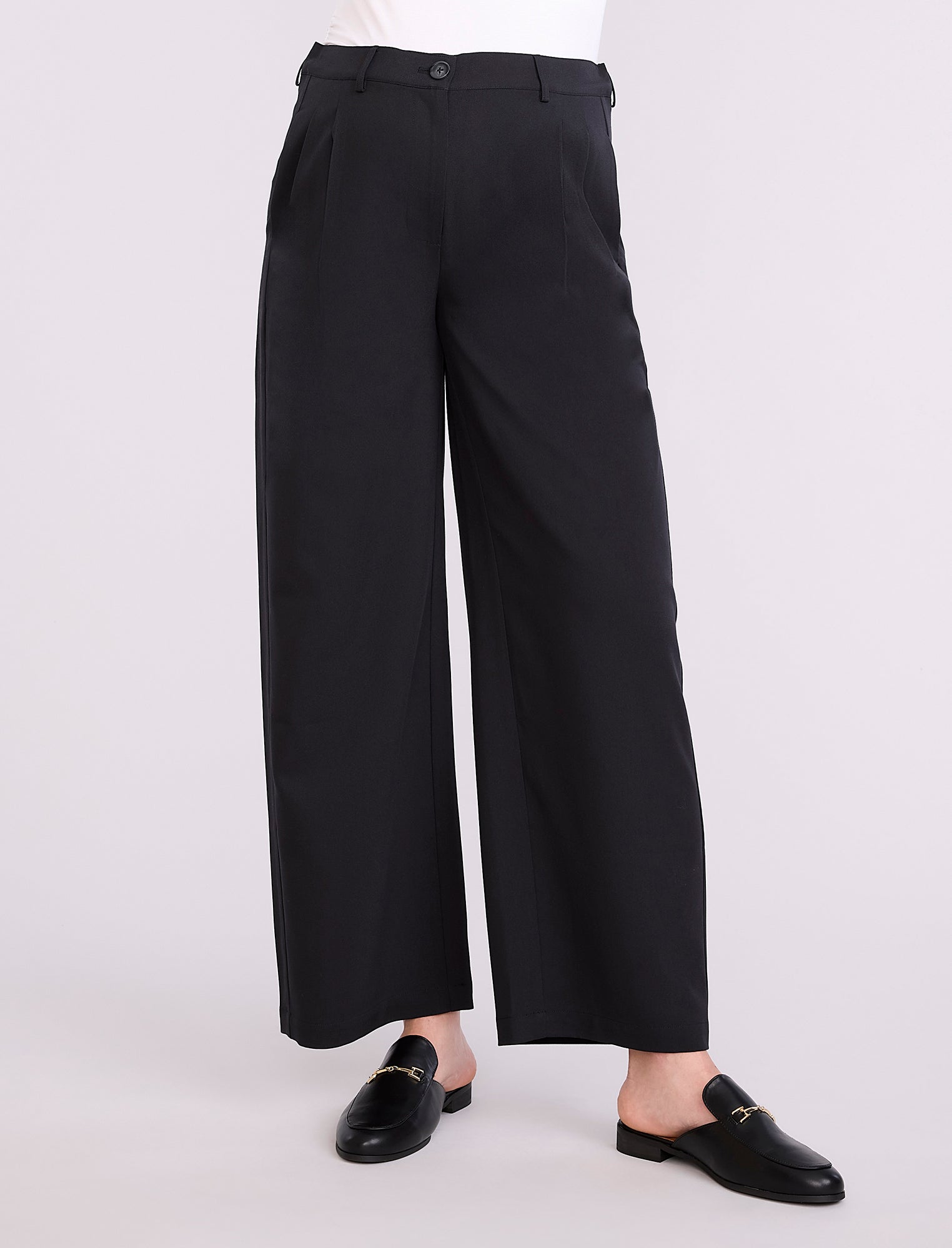 Black wide-leg maternity pants worn by a person on a white background