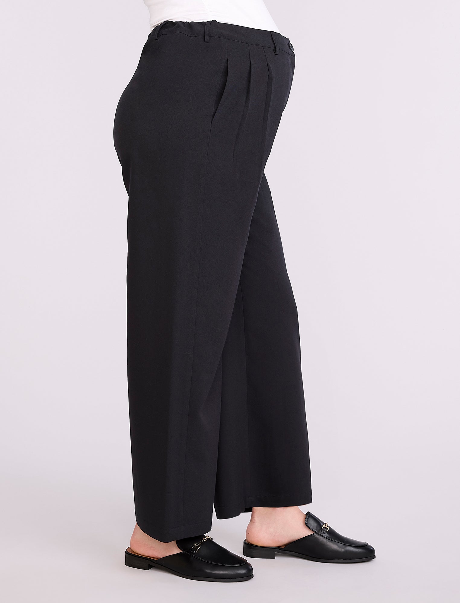 Black wide-leg maternity pants worn by a person on a white background