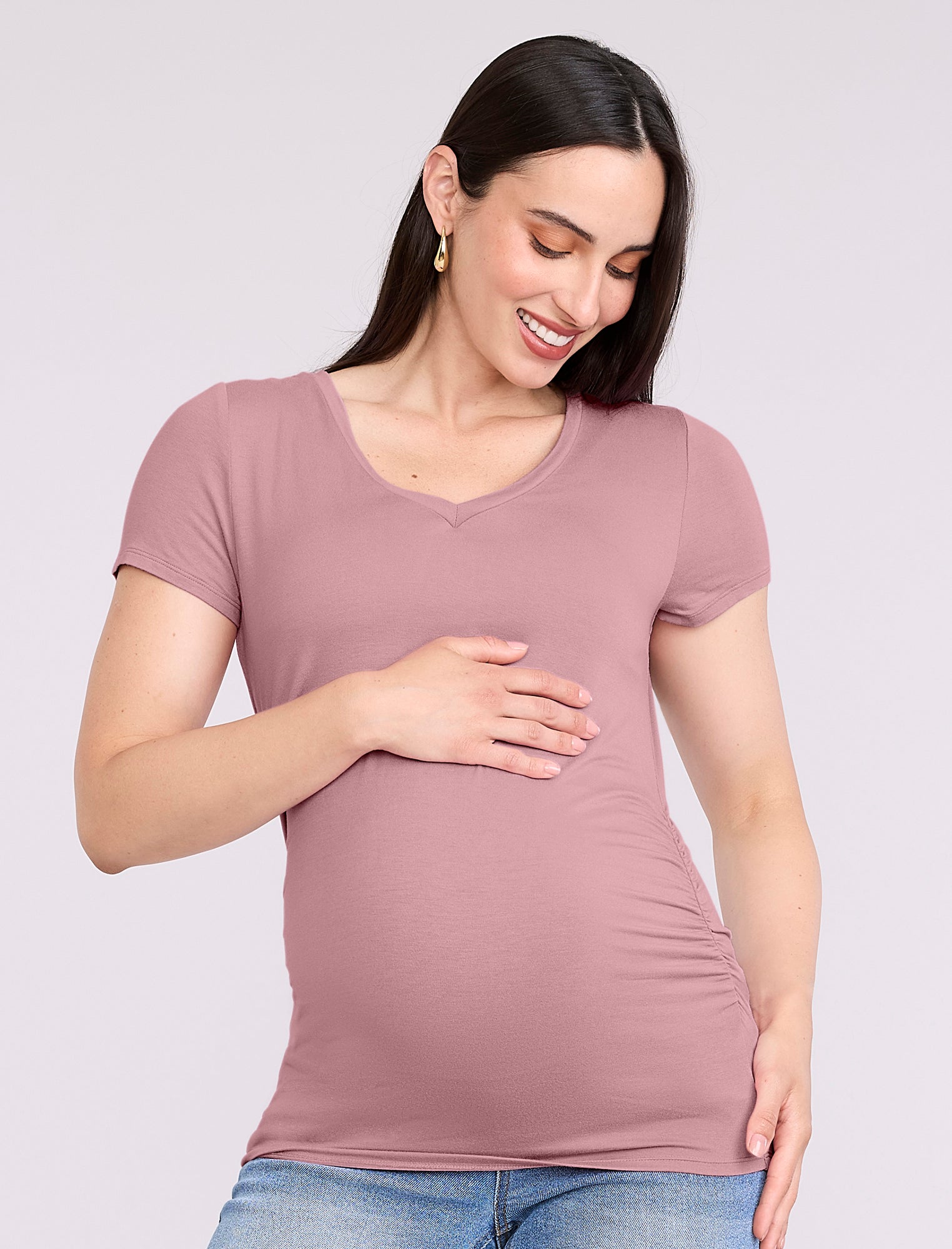 Pregnant woman wearing light pink t-shirt