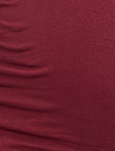 Close-up of a textured maroon fabric surface